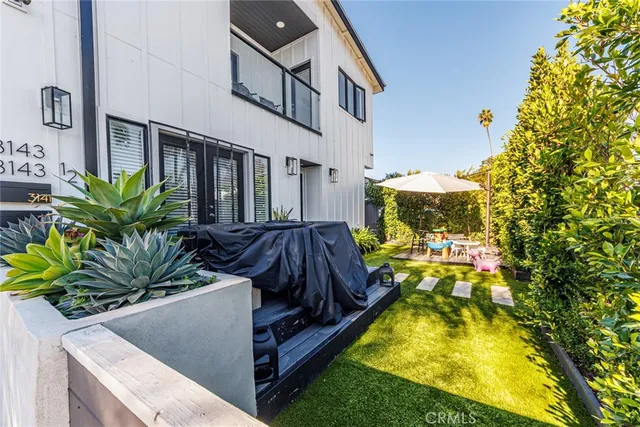 a view of swimming pool with outdoor seating and a yard