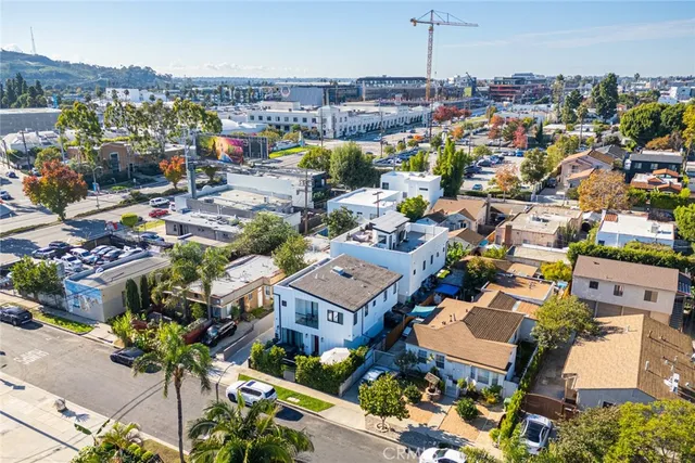 an aerial view of residential houses with city view