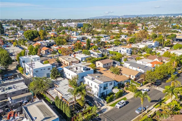 an aerial view of a city with lots of residential buildings
