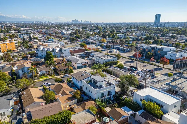 an aerial view of residential building with parking