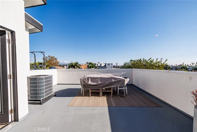 a balcony with furniture and city view