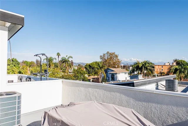 a view of a balcony with chair and table