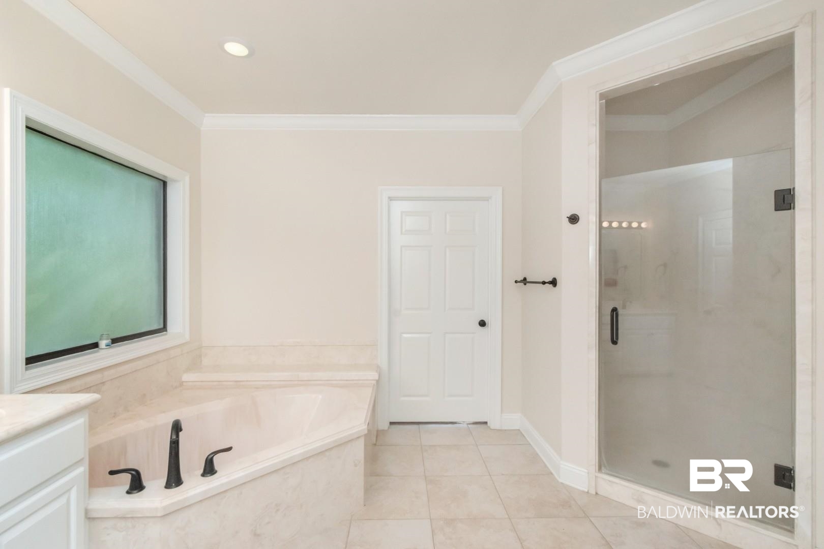1360 Dykes Road North Mobile, AL 36608 - Photo 18 of 40 Bathroom featuring a garden tub, vanity, a shower stall, light tile patterned floors, and ornamental molding