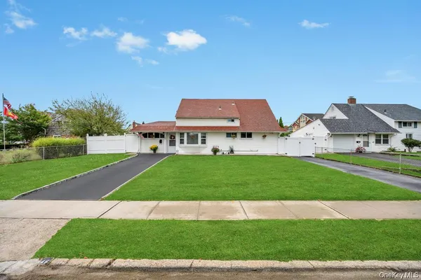 a view of house with garden space and street view
