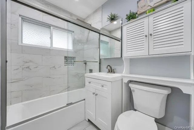 a bathroom with a toilet sink and bathtub