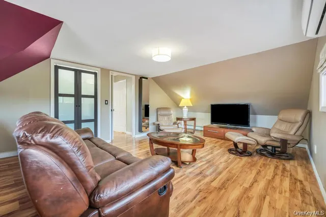 a living room with furniture or couch and a flat screen tv