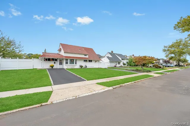 a view of green field with house in the background