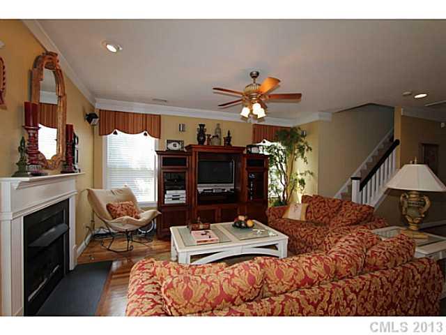 16538 Knox Run Road Huntersville, NC 28078 - Photo 3 of 14 a living room with furniture fireplace and flat screen tv