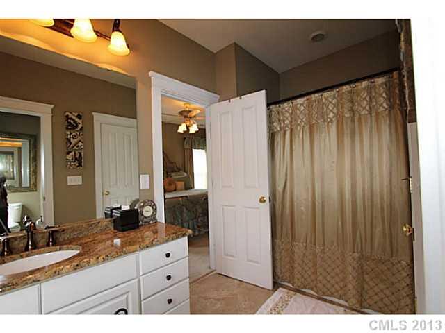 16538 Knox Run Road Huntersville, NC 28078 - Photo 8 of 14 a bathroom with a granite countertop sink and a mirror