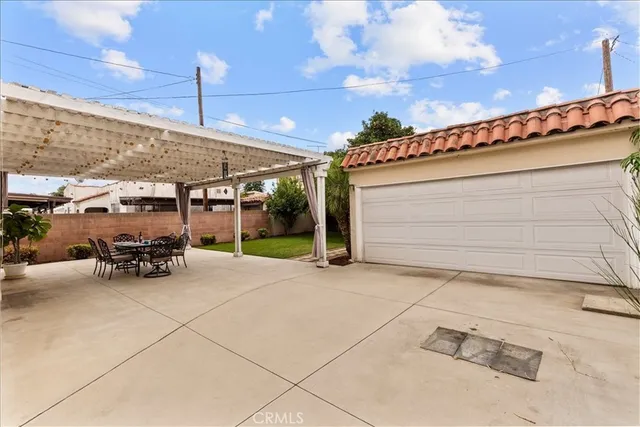 a view of a backyard with large trees