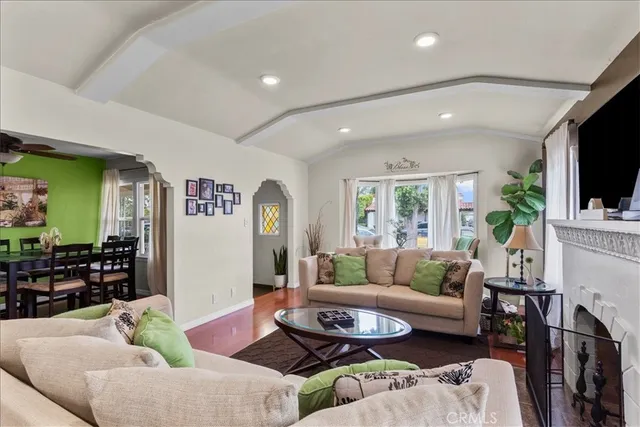 a view of a dining room with furniture and a window
