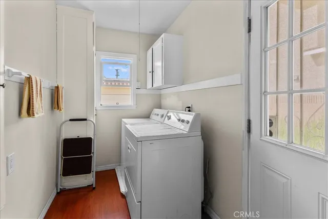 a kitchen with stainless steel appliances granite countertop a stove and a wooden floors