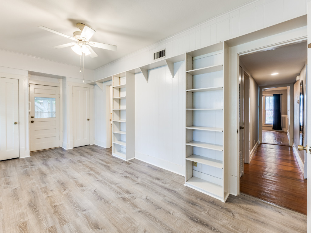 423 South Main Street Lockhart, TX 78644 - Photo 11 of 21 wooden floor in an empty room with a window