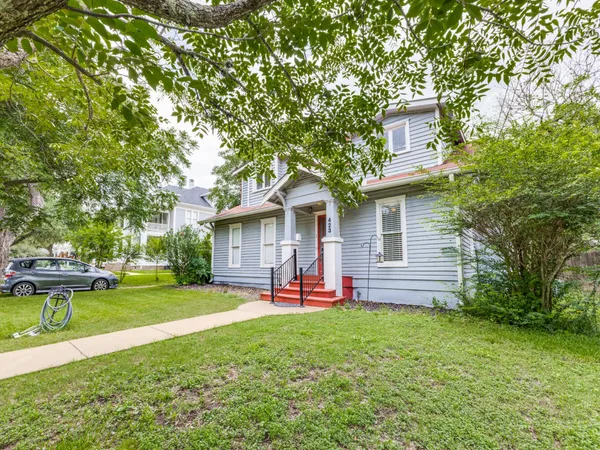 a view of a house with a yard porch and sitting area