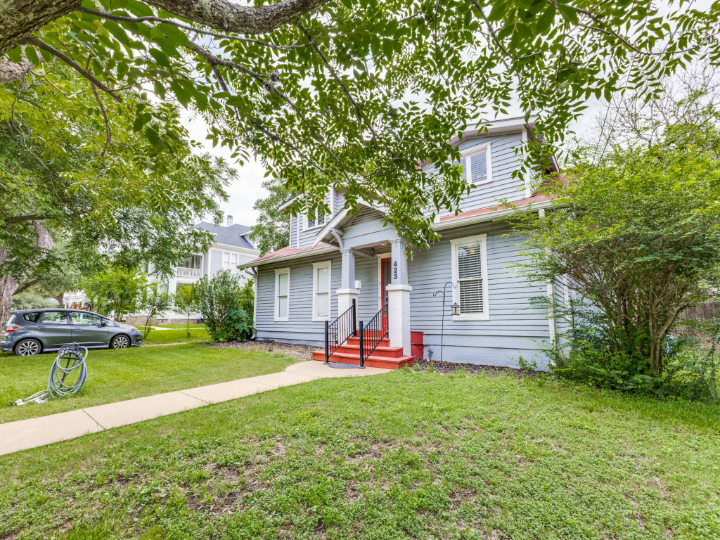 423 South Main Street Lockhart, TX 78644 - Photo 2 of 21 a view of a house with a yard porch and sitting area