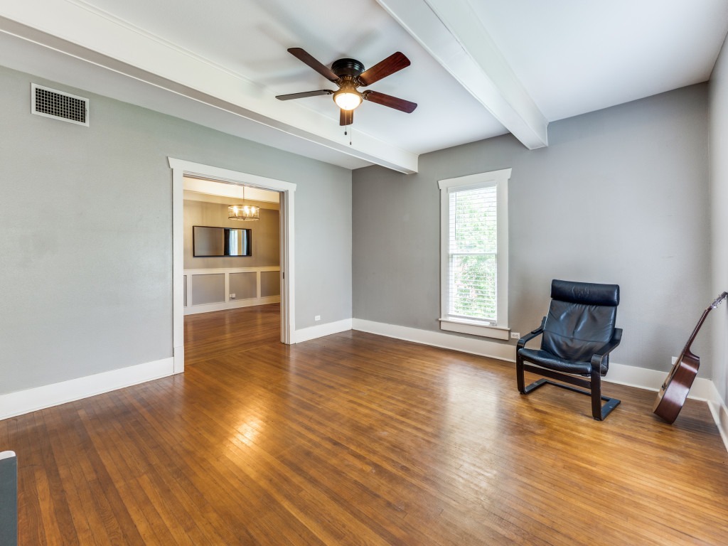 423 South Main Street Lockhart, TX 78644 - Photo 10 of 21 a view of room with wooden floor and ceiling fan