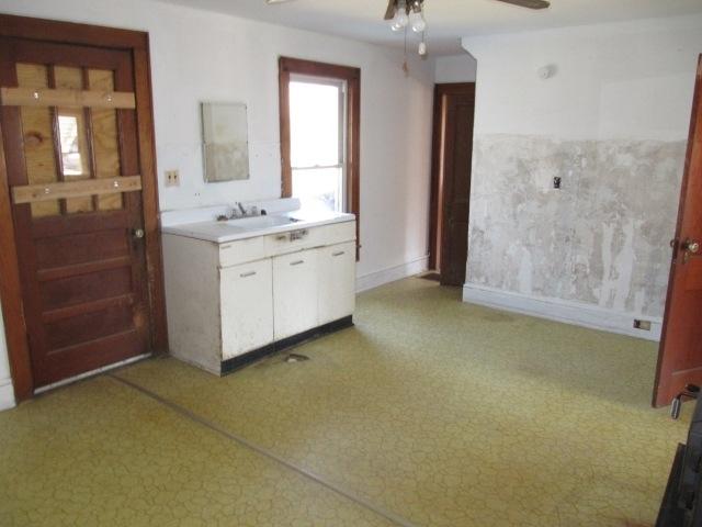 2059 Burkette Road Elliston, VA 24087 - Photo 11 of 18 a bathroom with a granite countertop sink mirror and shower