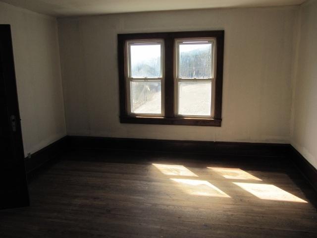 2059 Burkette Road Elliston, VA 24087 - Photo 13 of 18 a view of a room with wooden floor and a window