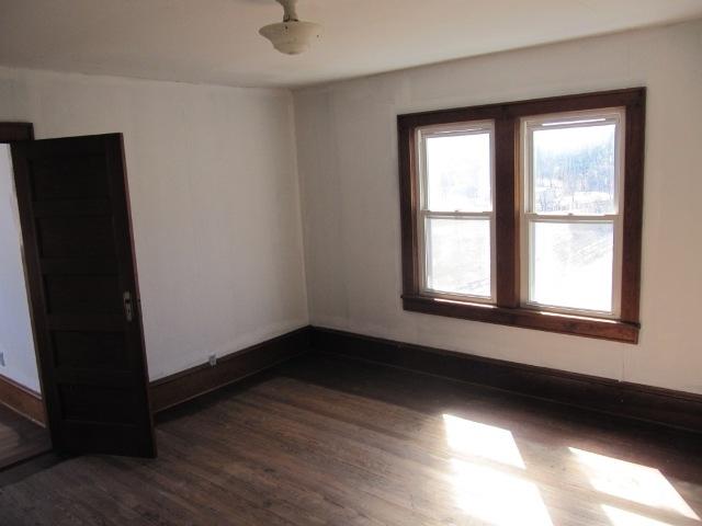 2059 Burkette Road Elliston, VA 24087 - Photo 14 of 18 a view of an empty room with wooden floor and a window