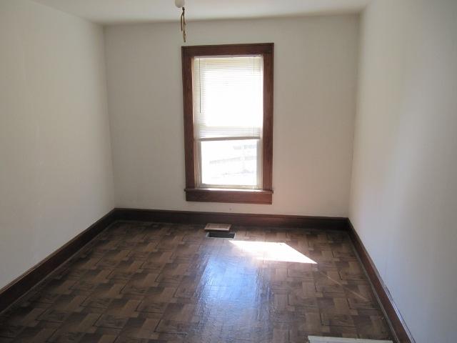 2059 Burkette Road Elliston, VA 24087 - Photo 7 of 18 an empty room with wooden floor and windows