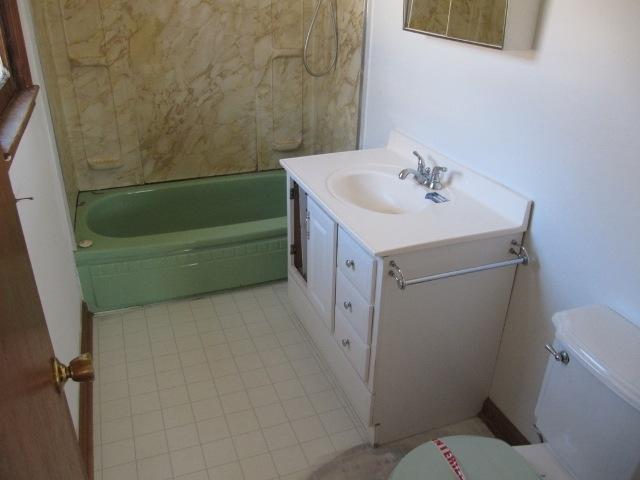 2059 Burkette Road Elliston, VA 24087 - Photo 10 of 18 a bathroom with a sink and a toilet