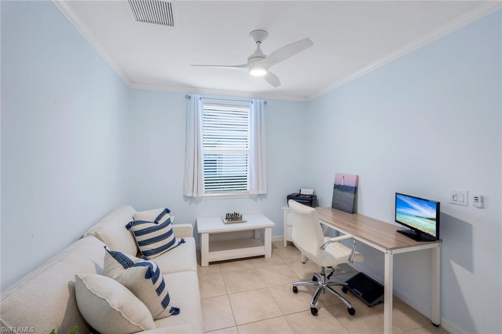14795 Edgewater Circle Naples, FL 34114 - Photo 17 of 39 a workspace with furniture and a window