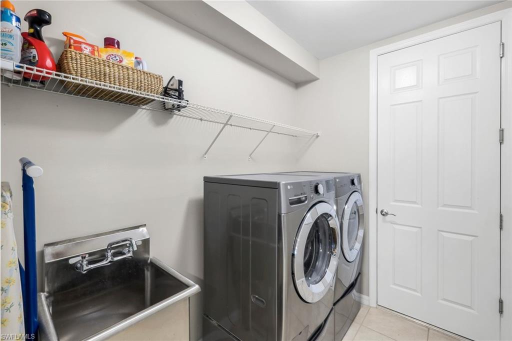 14795 Edgewater Circle Naples, FL 34114 - Photo 20 of 39 a utility room with dryer and washer