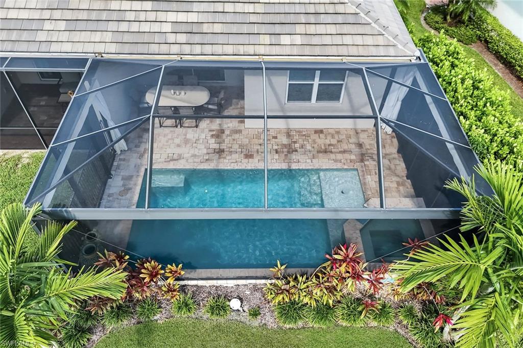 14795 Edgewater Circle Naples, FL 34114 - Photo 24 of 39 a front view of a house with a yard