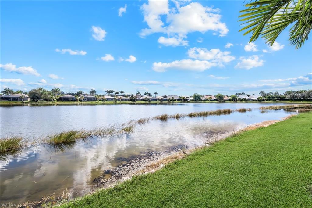 14795 Edgewater Circle Naples, FL 34114 - Photo 26 of 39 a view of a lake with a city