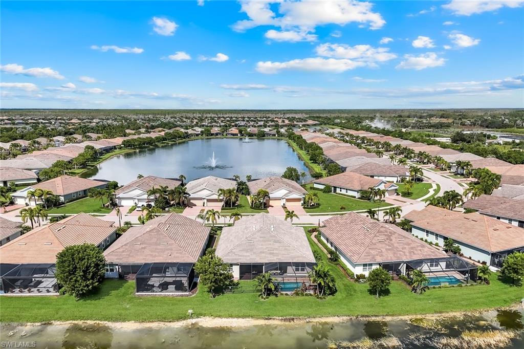 14795 Edgewater Circle Naples, FL 34114 - Photo 32 of 39 an aerial view of a house with garden space and ocean view
