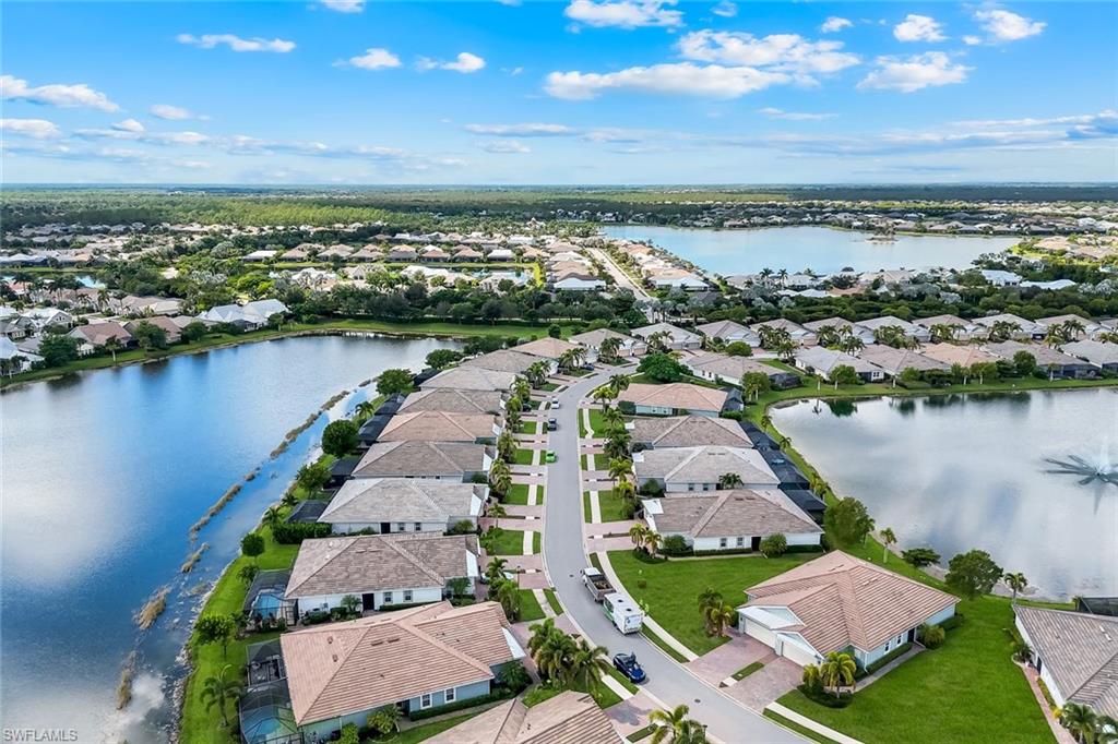14795 Edgewater Circle Naples, FL 34114 - Photo 33 of 39 an aerial view of a city with lake view