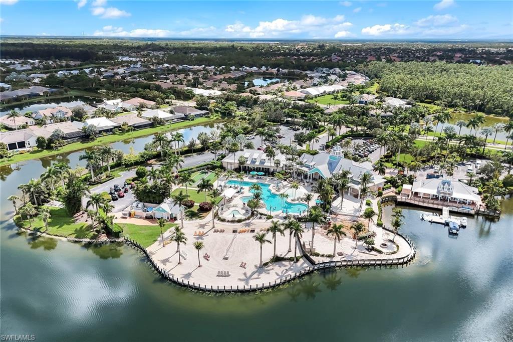 14795 Edgewater Circle Naples, FL 34114 - Photo 34 of 39 a view of a swimming pool with a yard