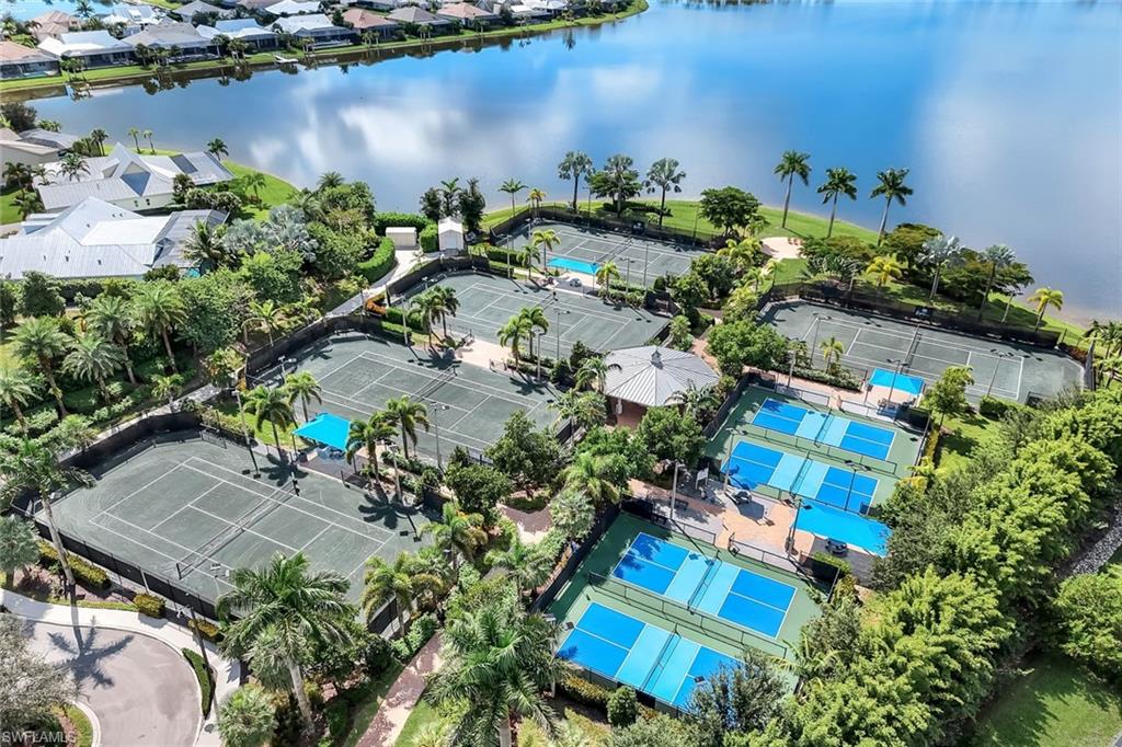14795 Edgewater Circle Naples, FL 34114 - Photo 35 of 39 an aerial view of a house with a lake view