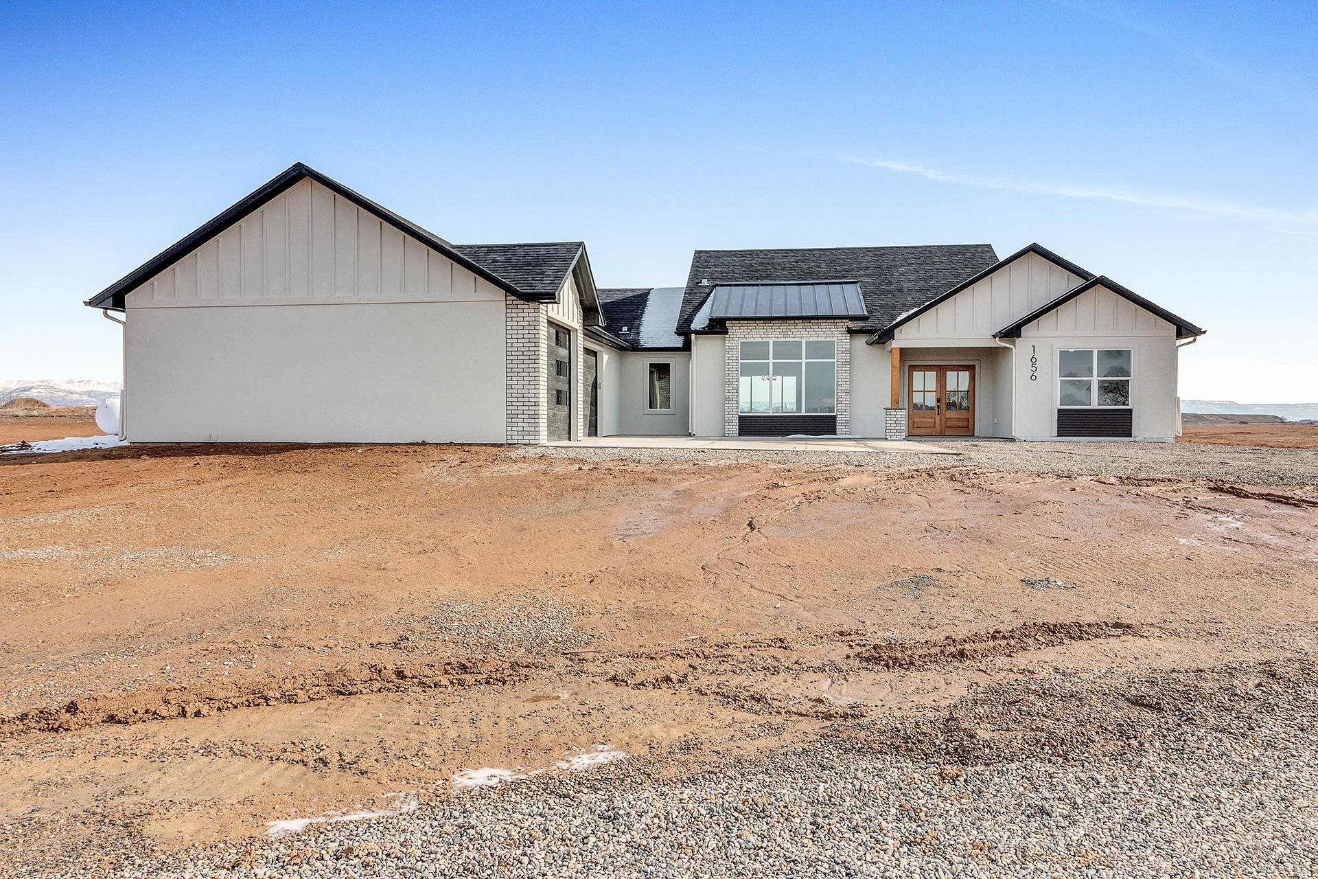 1656 8 Road Mack, CO 81525 - Photo 1 of 28 a view of a house with a yard