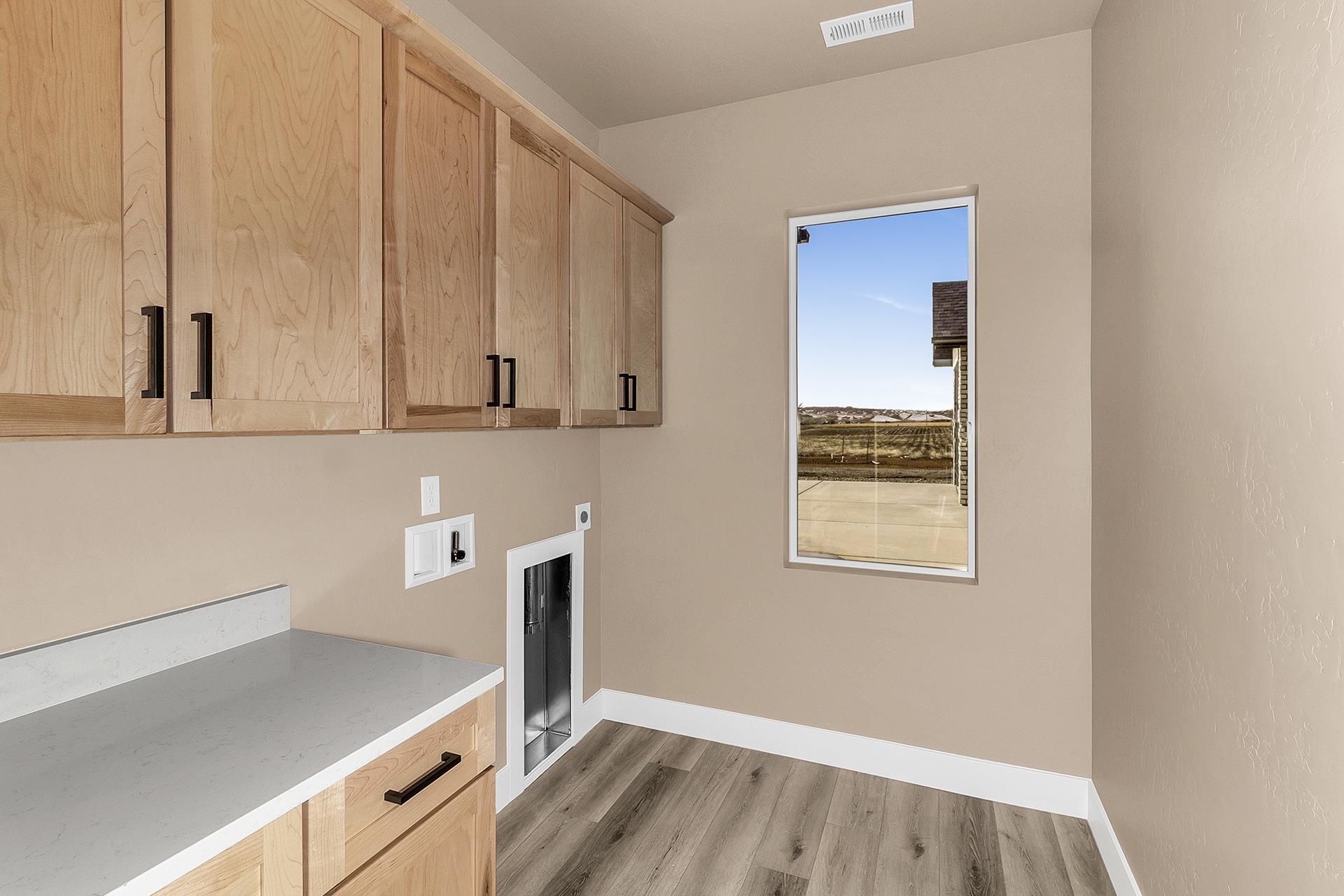 1656 8 Road Mack, CO 81525 - Photo 18 of 28 a room with wooden floor and cabinets