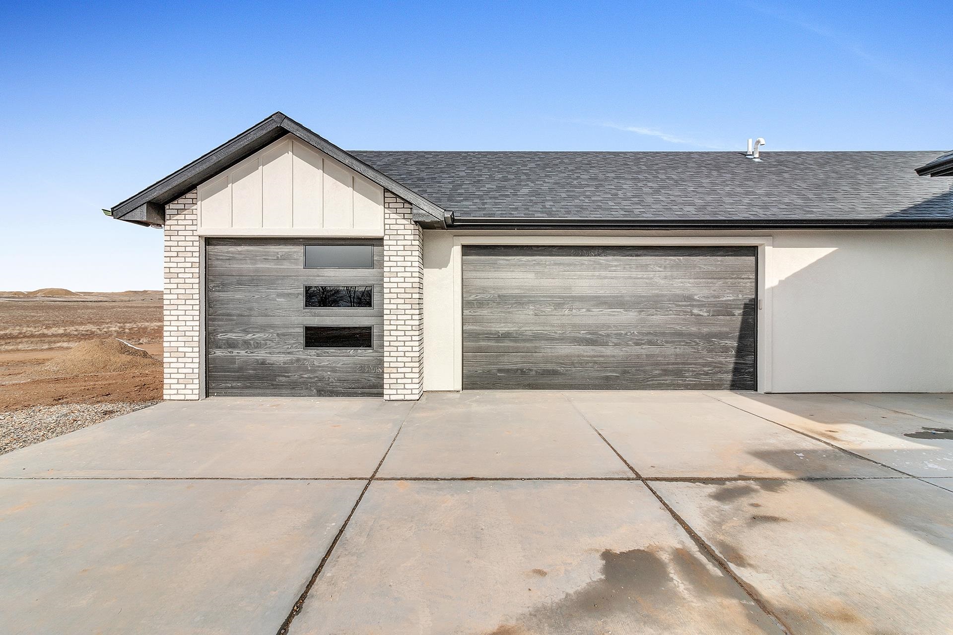 1656 8 Road Mack, CO 81525 - Photo 4 of 28 a front view of a house with a garage