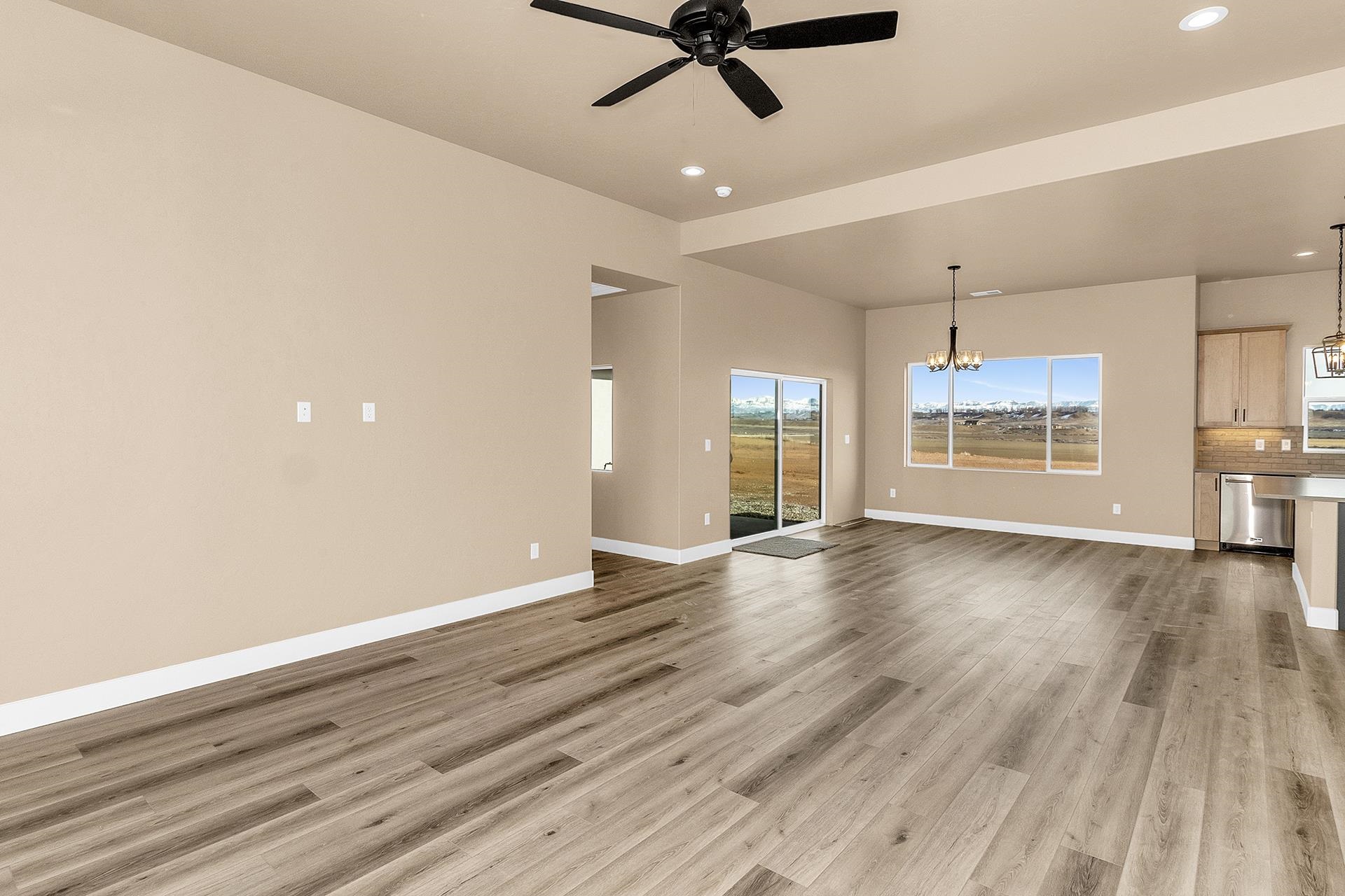 1656 8 Road Mack, CO 81525 - Photo 6 of 28 wooden floor in an empty room with a window