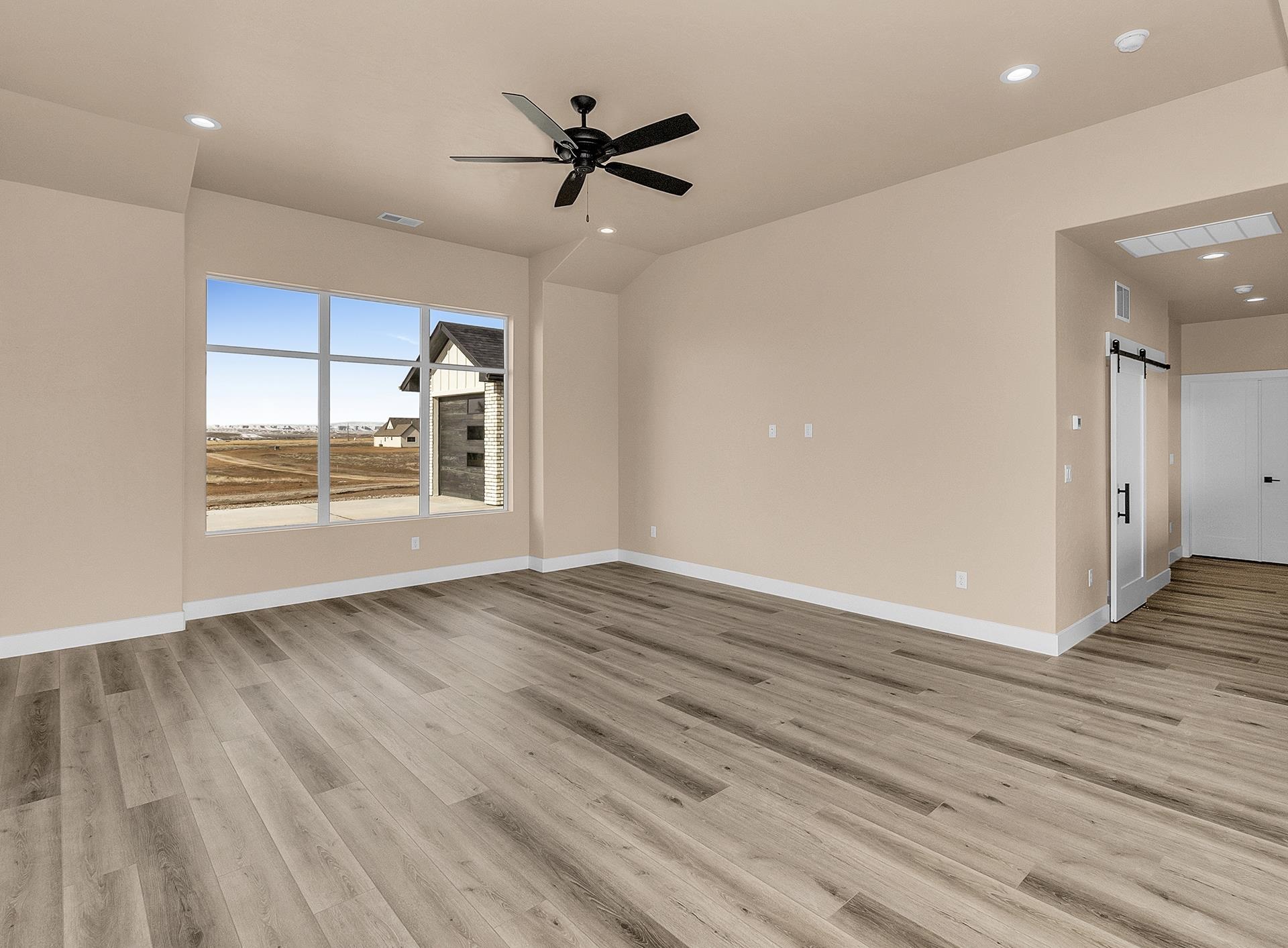 1656 8 Road Mack, CO 81525 - Photo 10 of 28 wooden floor in an empty room with a window