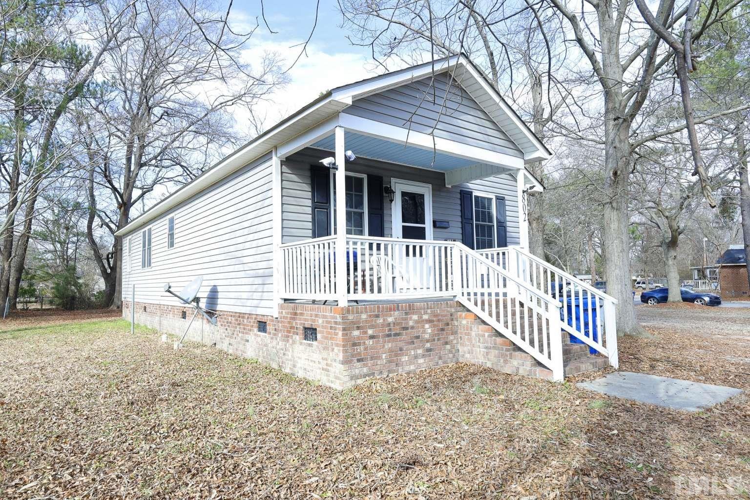 802 South Webb Street Selma, NC 27576 - Photo 1 of 25 a front view of a house with a yard