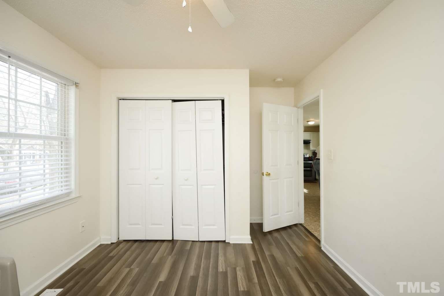 802 South Webb Street Selma, NC 27576 - Photo 16 of 25 wooden floor in an empty room with a window