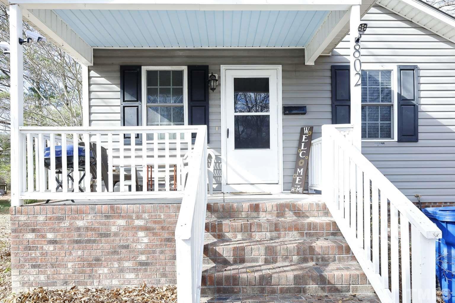 802 South Webb Street Selma, NC 27576 - Photo 2 of 25 a view of a brick house with large windows