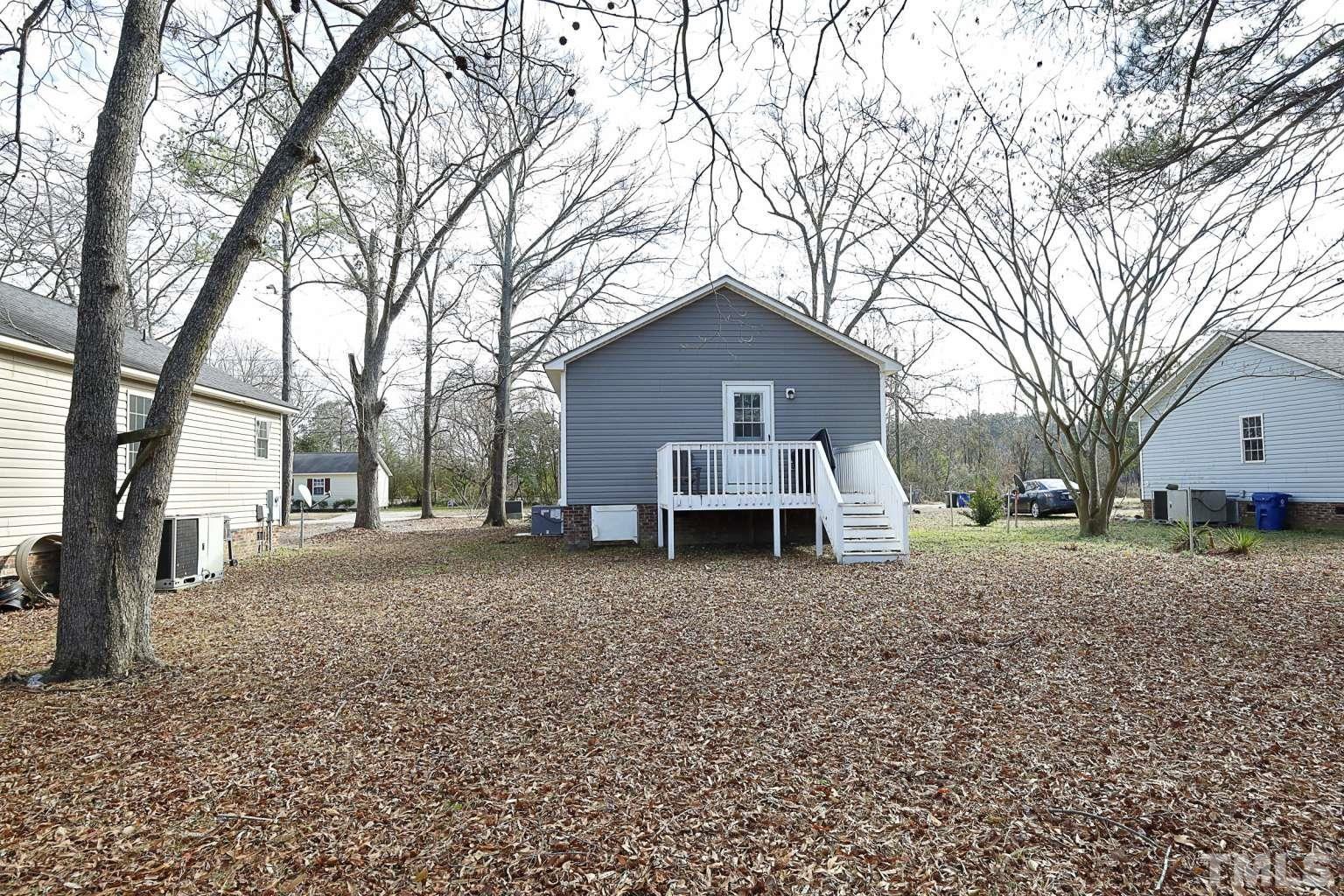 802 South Webb Street Selma, NC 27576 - Photo 23 of 25 a view of a house with a yard covered in snow