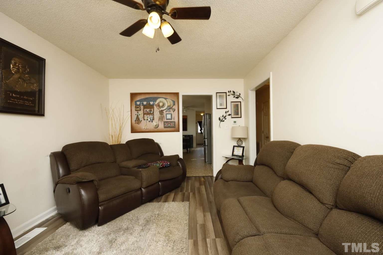 802 South Webb Street Selma, NC 27576 - Photo 4 of 25 a living room with furniture and a couch