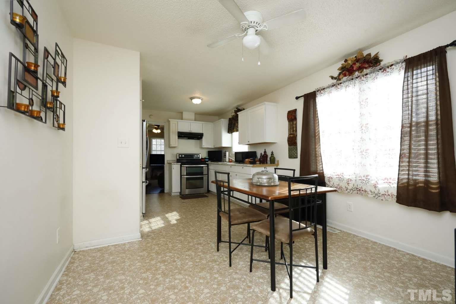 802 South Webb Street Selma, NC 27576 - Photo 5 of 25 a view of a dining room with furniture
