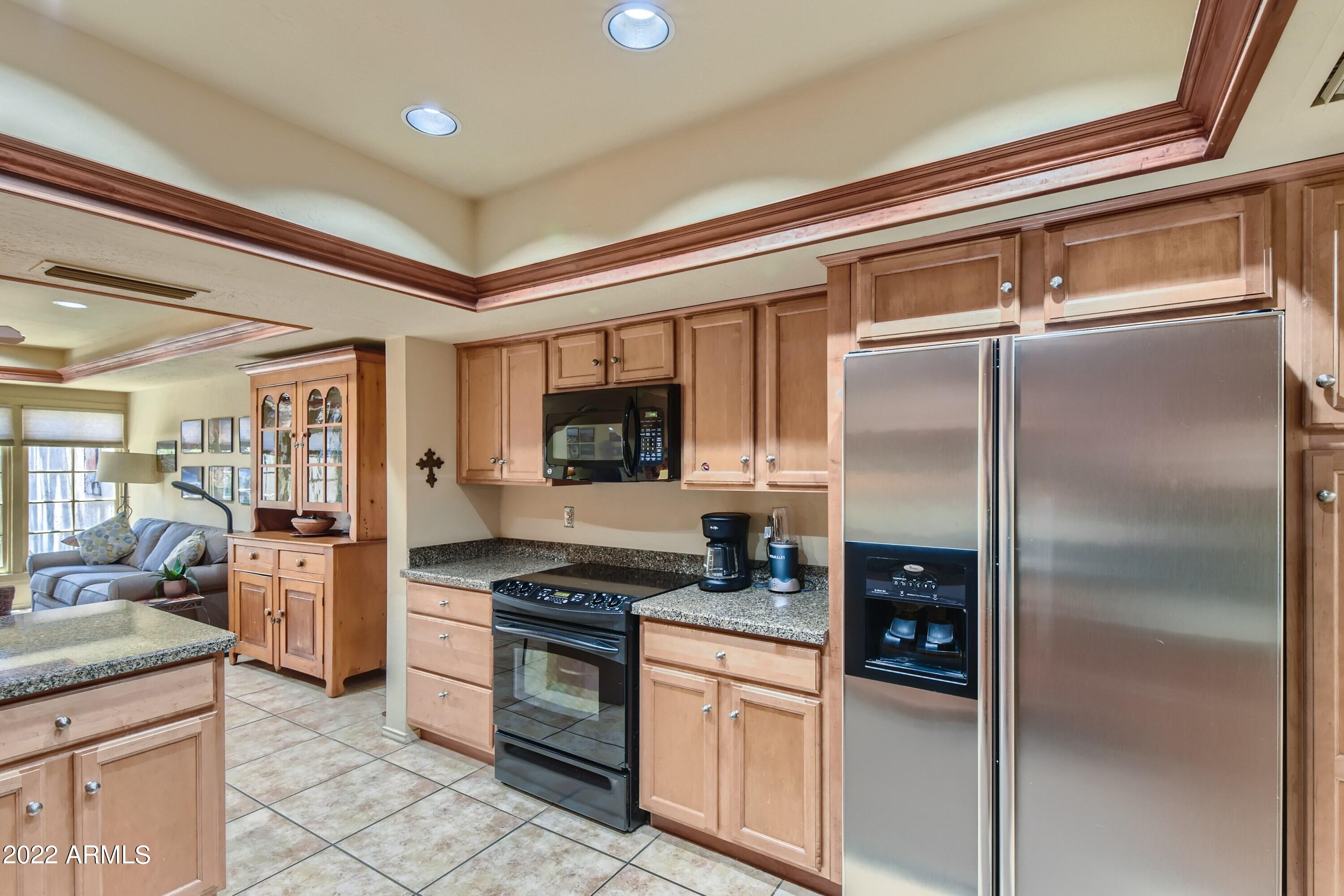 4438 East Camelback Road, Unit 152 Phoenix, AZ 85018 - Photo 11 of 30 S/S appliances & open to fam rm