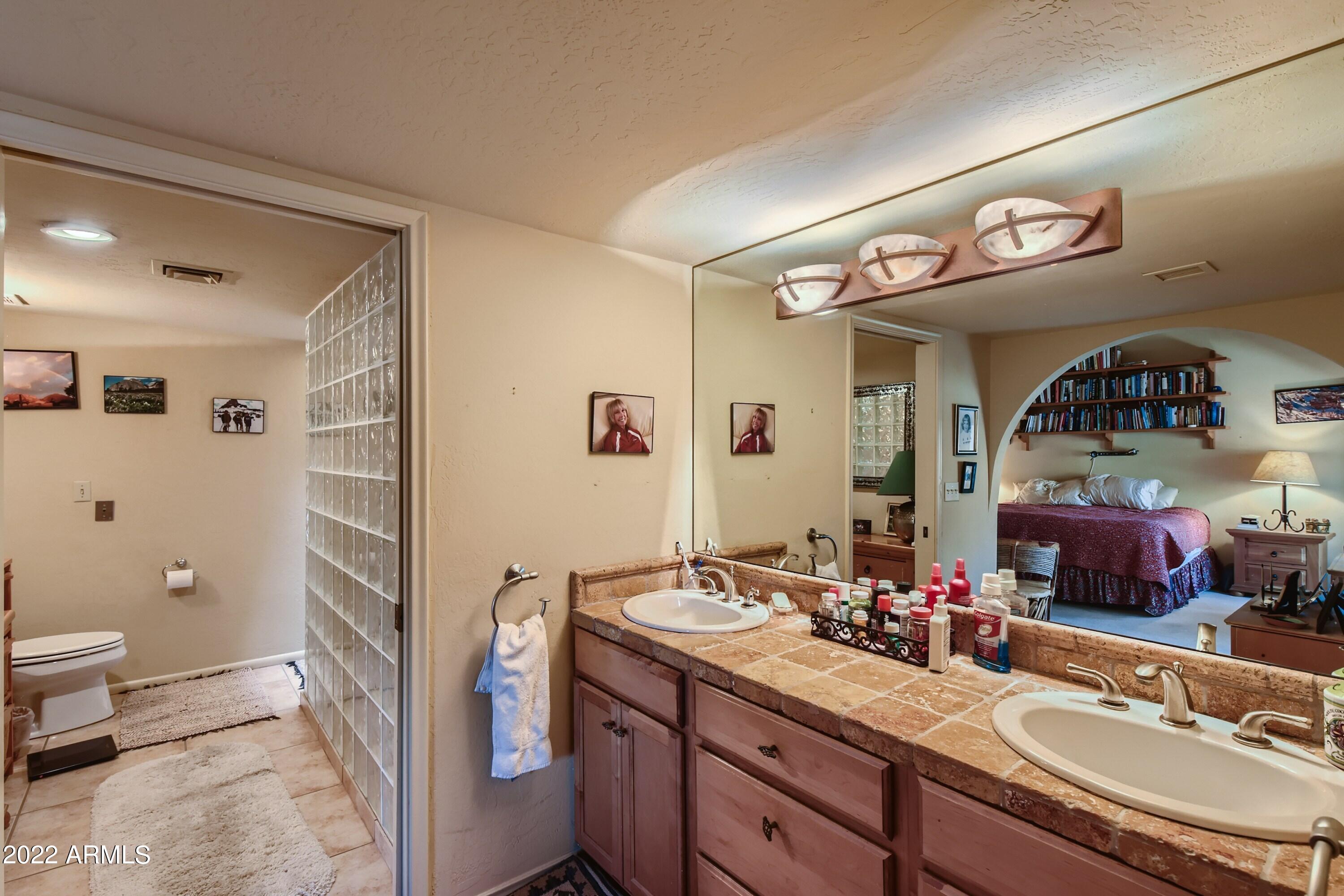 4438 East Camelback Road, Unit 152 Phoenix, AZ 85018 - Photo 19 of 30 Master bath w/snail glass block shower