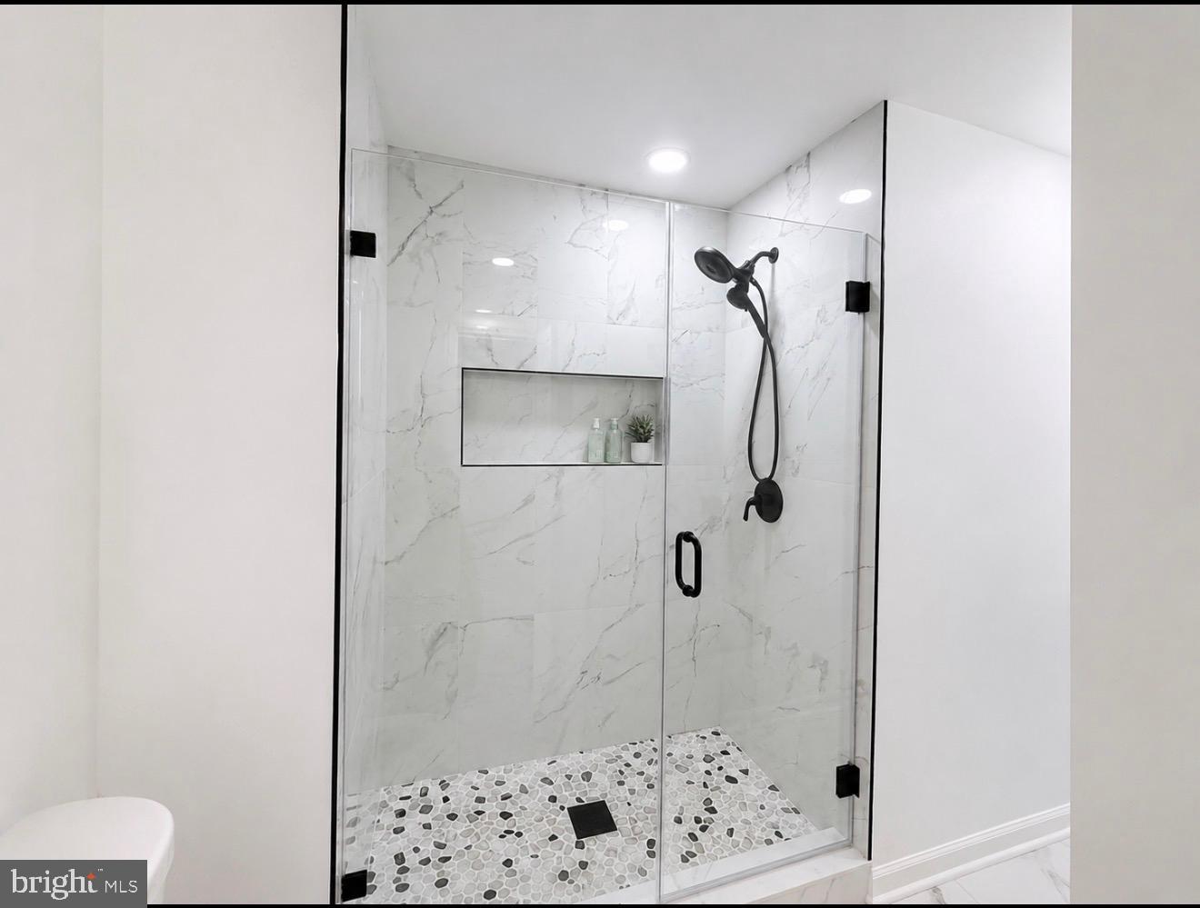 100 Rugby Fredericksburg, VA 22406 - Photo 4 of 41 Sleek modern shower with elegant tiles.