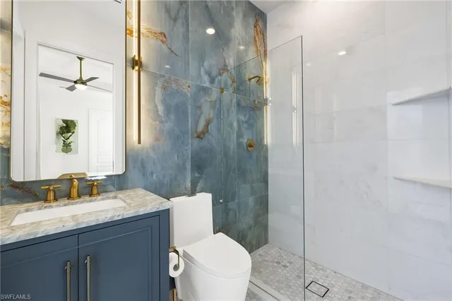 a view of a patio with dining table and chairs with a fire pit