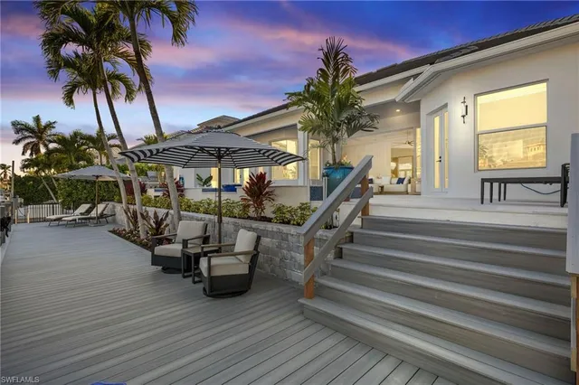 a kitchen with granite countertop a stove and a sink