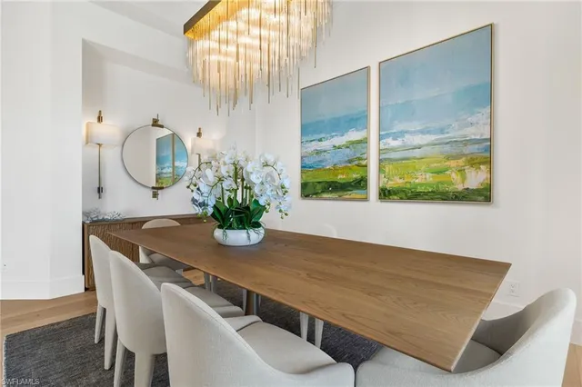 a view of a house with roof and potted plants
